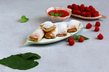 Freshly baked homemade cookies with raspberry jam on a white plate, selective focus