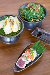 Assorted asian dishes served on the restaurant table