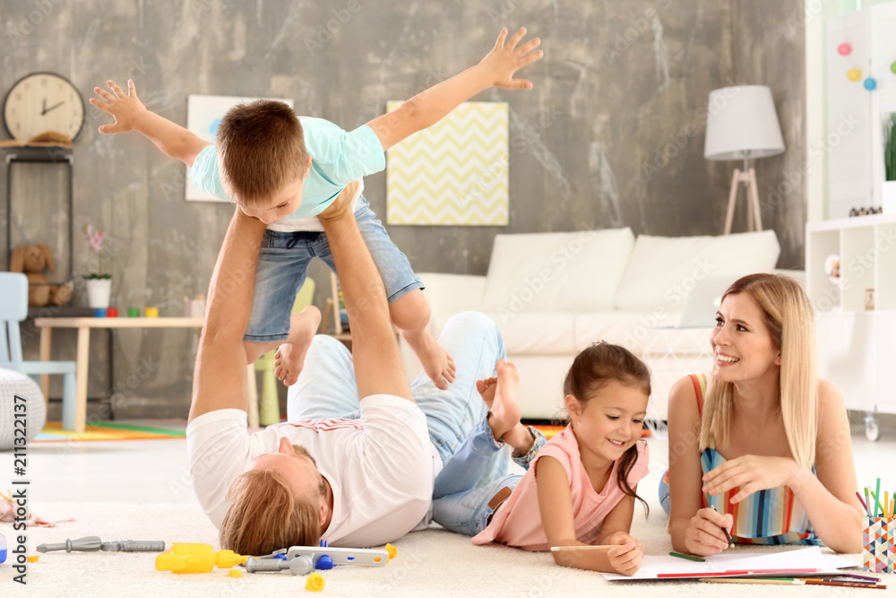 Wall mural parents spending time with children at home