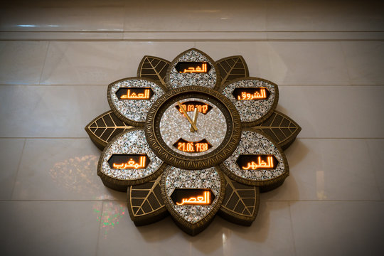 ABU DHABI ,UAE - MARCH 20,2017:World clock display time in different languages in the Grand Mosque of Abu Dhabi, UAE