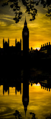 Fototapeta na wymiar Sunset silhouette of Big Ben with reflection in London. England
