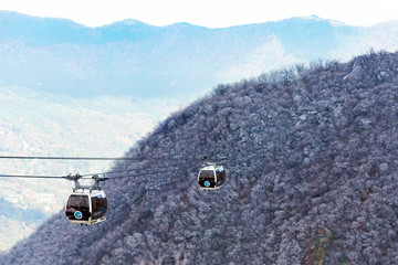 View of the cable car on the background of the autumn mountains, Hakone, Japan.