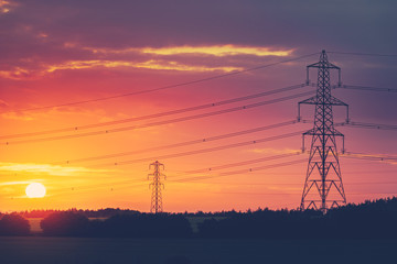 Electric transmission towers at sunset