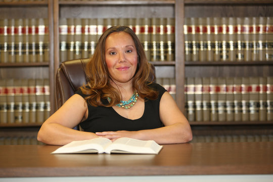 Portrait of a young attractive woman, woman lawyer in law office.