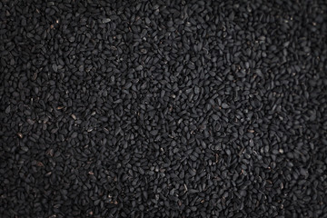 Black sesame seeds isolated on white background