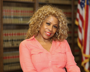 Portrait of an attractive African American woman. Woman lawyer inside law office.