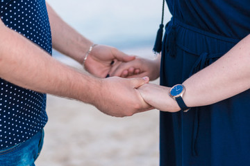 Happy volunteer family putting their hands together