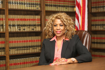Portrait of an attractive African American woman. Woman lawyer inside law office.