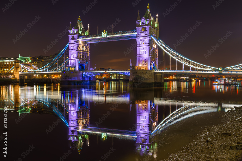 Sticker tower bridge with reflections at night in london