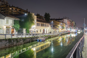 Fototapeta na wymiar MILAN, ITALY - OCTOBER, 2015 - The Old City canal viewed from Via Ascanio Sforza street at night.