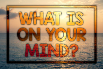 Fototapeta na wymiar Writing note showing What Is On Your Mind Question. Business photo showcasing Open minded thinks of intellectual innovation Sunset blue beach cloudy sky ideas message thoughts feelings.