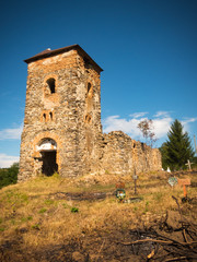 Fototapeta na wymiar Ruins of an old medieval church dated around the 13th or 14th century, with a nearby cemetery, Romania, Europe