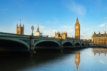 Fototapeta na wymiar Big Ben and Westminster parliament with colorful sky and water reflection in London, United Kingdom