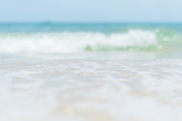 Soft focus of sand beach, blue sky and soft wave background. summer holiday and vacation concept.