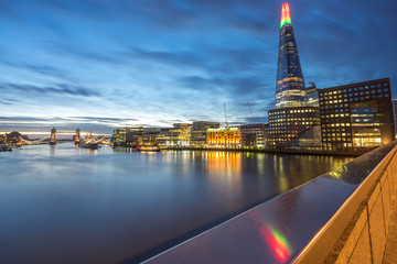 Skyline of London at dawn with Tower Bridge in the background