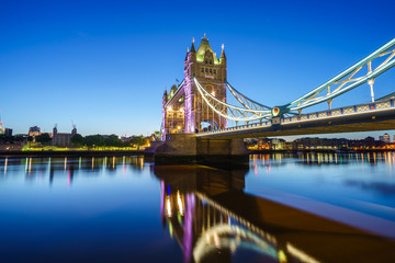Tower Bridge illuminated at dawn. London, England