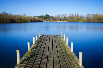 Naklejka premium A pier at Tongwell Lake in Milton Keynes, UK