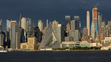 Fototapeta na wymiar JUNE 6, 2018 - NEW YORK, NEW YORK, USA - New York City and Hudson River features VIA 57 Building (Sale triangular shaped) and Manhattan Skyline