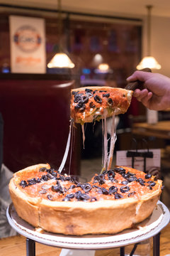 One piece of Chicago deep dish is ready to serve