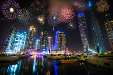 Fototapeta na wymiar Firework display at Dubai marina at night, UAE