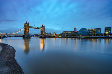 Panorama of Tower Bridge with blue sky and reflection in London. England
