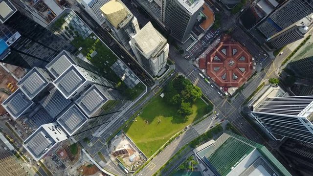 Overhead aerial drone shot of grid structure, skyscraper office buildings of major banking and other corporations in financial and business center downtown Singapore
