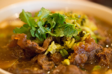 Authentic Sichuan style spicy Chinese food on the table, closeup.