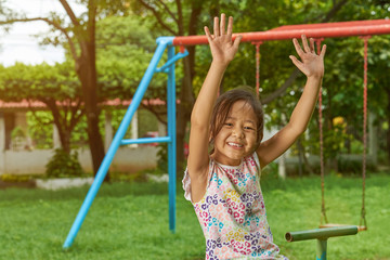 Fototapeta premium Asian girl having fun in park