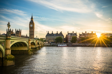 Big Ben and Westminster bridge with sunset flare 