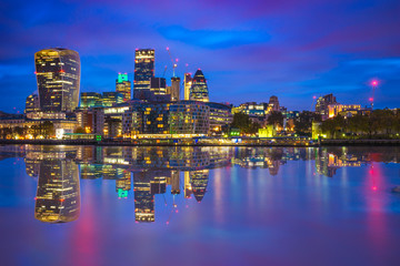 Fototapeta na wymiar London finance district at dusk with reflection