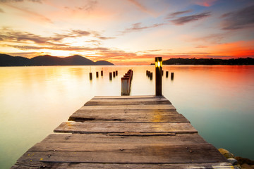 Beautiful view of sunset at Marina Island Old Jetty,Malaysia. soft focus, blur due to long exposure. Visible noise due to high ISO.