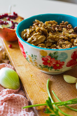 Walnuts in ceramic bowl good for salads, lunch or dinner meal and desserts. Raw vegan vegetarian healthy food.