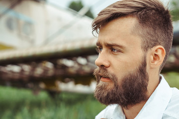 a man on the background of an old plane
