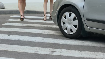 Irresponsible driver run over girls on pedestrian crossing, traffic violation