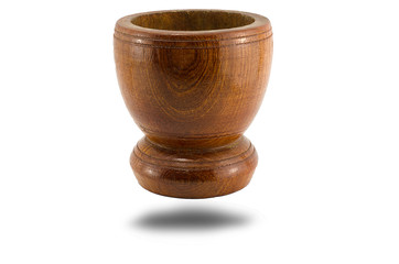 It is a wooden mortar and mortar on old wooden white background