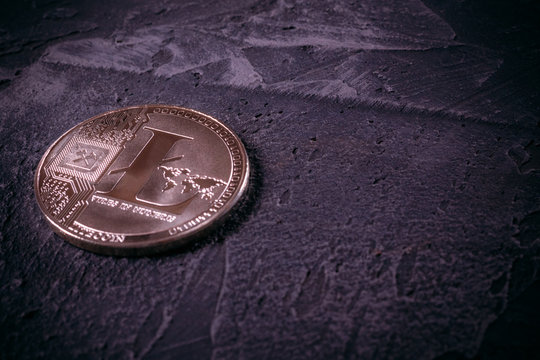 Coin Litcoin LTC on a concrete background with copy space