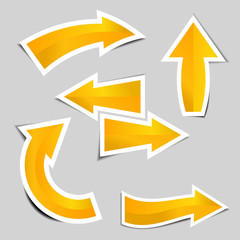 Set of gold arrow stickers with shadow