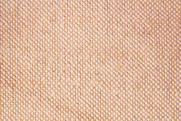 neutral beige linen fabric background with texture close up