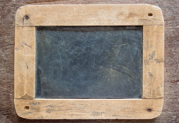 Blackboard with wooden frame, blackboard on old wood background