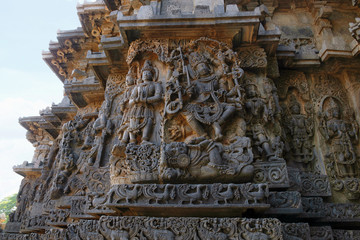 Ornate wall panel reliefs depicting Shiva and other deities, west side, Hoysaleshwara temple, Halebidu, Karnataka. view from West.
