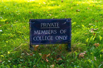 Private member of college only sign on the grass 