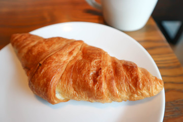 croissant and hot coffee