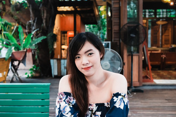 Close up of young Asian woman in the restaurant.