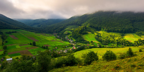 Fototapeta na wymiar Abranka village in Carpathian mountains. lovely rural scenery on a cloudy sunrise. 