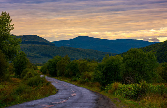 mountainous road on cloudy sunrise. lovely landscape in early autumn