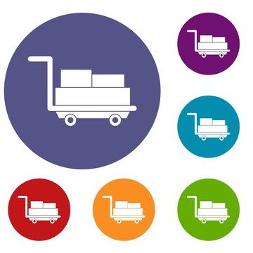 Cart with luggage icons set in flat circle red, blue and green color for web