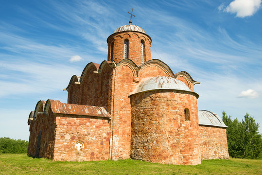 The ancient church of the Transfiguration of Our Savior on Kovalyovo on a sunny summer day. Neighborhoods of Veliky Novgorod, Russia