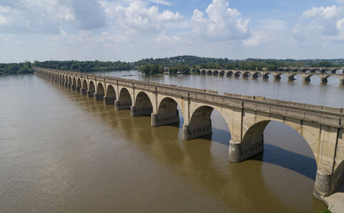 Fototapeta premium Stone Arch Bridge Train Tracks Crossing Susquehanna River From Harrisburg to Wormleysburg Pennsylvania