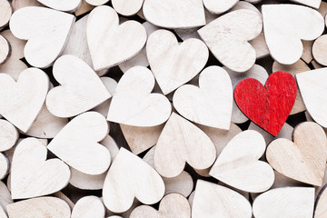 Background with wooden hearts, place for text.