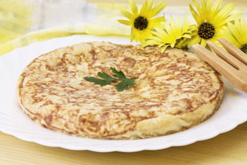 plate of potato omelette on the wooden table
